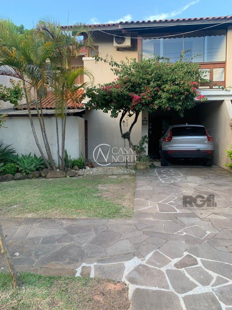 Casa de Condomínio à venda com 3 quartos, 233m², 1 suíte, 2 vagas, Avenida Eduardo Prado no bairro Cavalhada em Porto Alegre