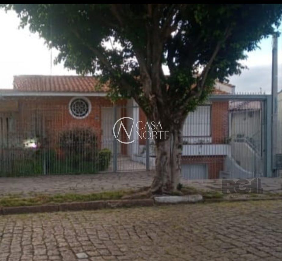 Casa à venda com 4 quartos, 414m², 1 suíte, 4 vagas, Rua Delfino Riet no bairro Santo Antônio em Porto Alegre