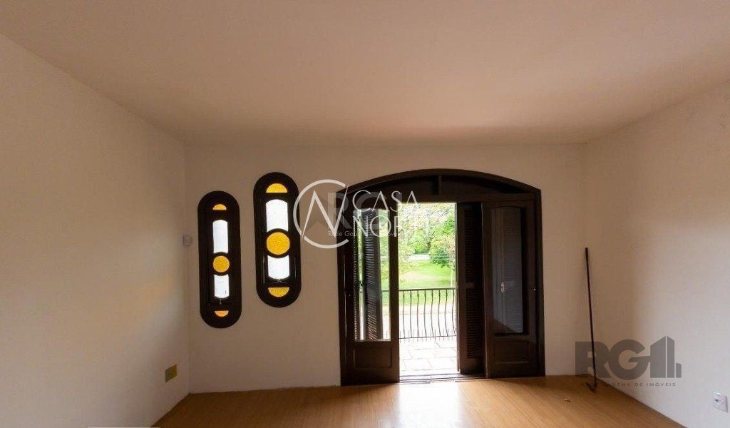 Casa à venda com 4 quartos, 450m², 3 suítes, 5 vagas, Rua Marcio Dias no bairro Nonoai em Porto Alegre