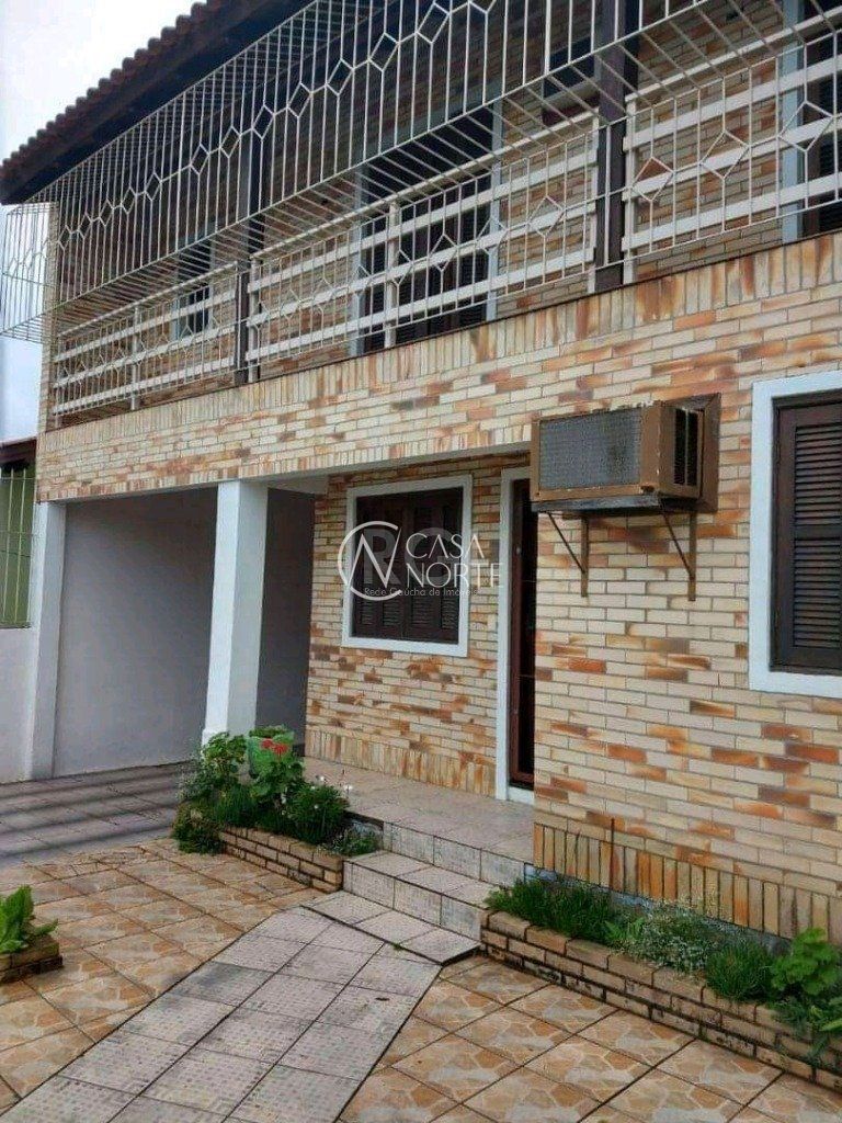 Casa à venda com 4 quartos, 320m², 2 vagas, Rua Miguel Ascoleze no bairro Vila Nova em Porto Alegre