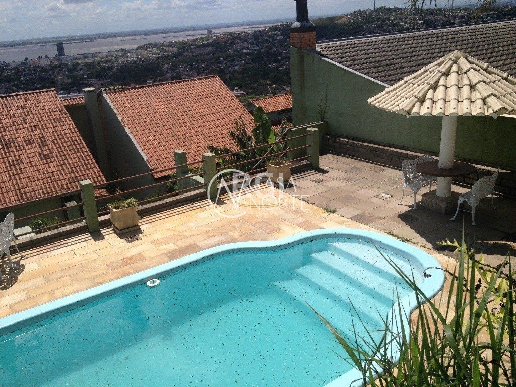 Casa de Condomínio à venda com 4 quartos, 350m², 1 suíte, 2 vagas, Rua Alcebiades Antônio dos Santos no bairro Nonoai em Porto Alegre