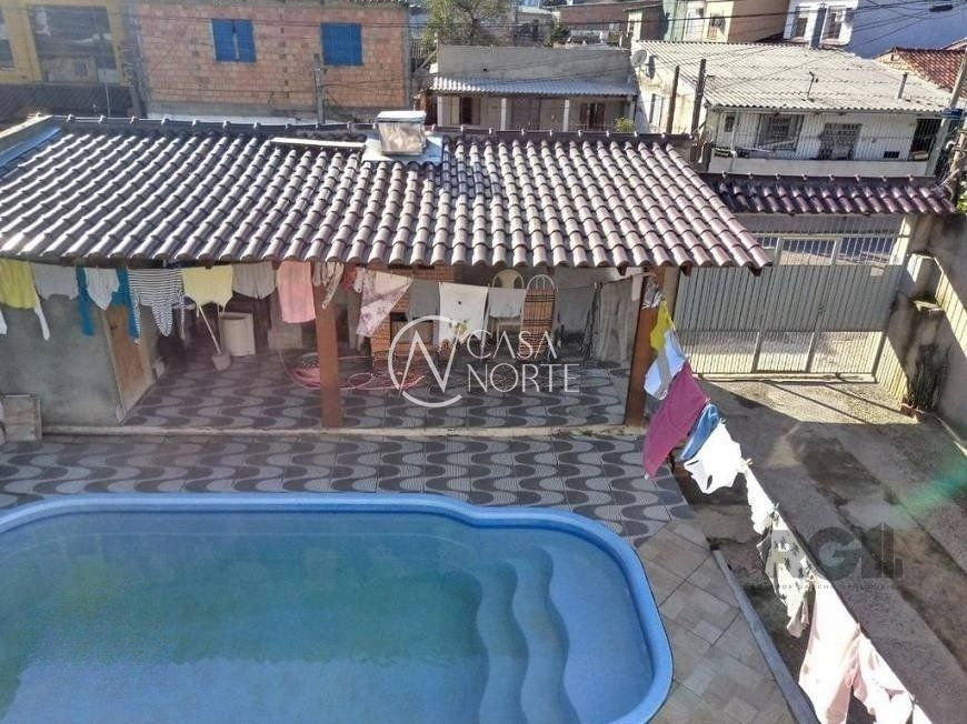 Casa à venda com 4 quartos, 191m², 1 suíte, 4 vagas, Rua Amadeu Amaral no bairro Vila São José em Porto Alegre