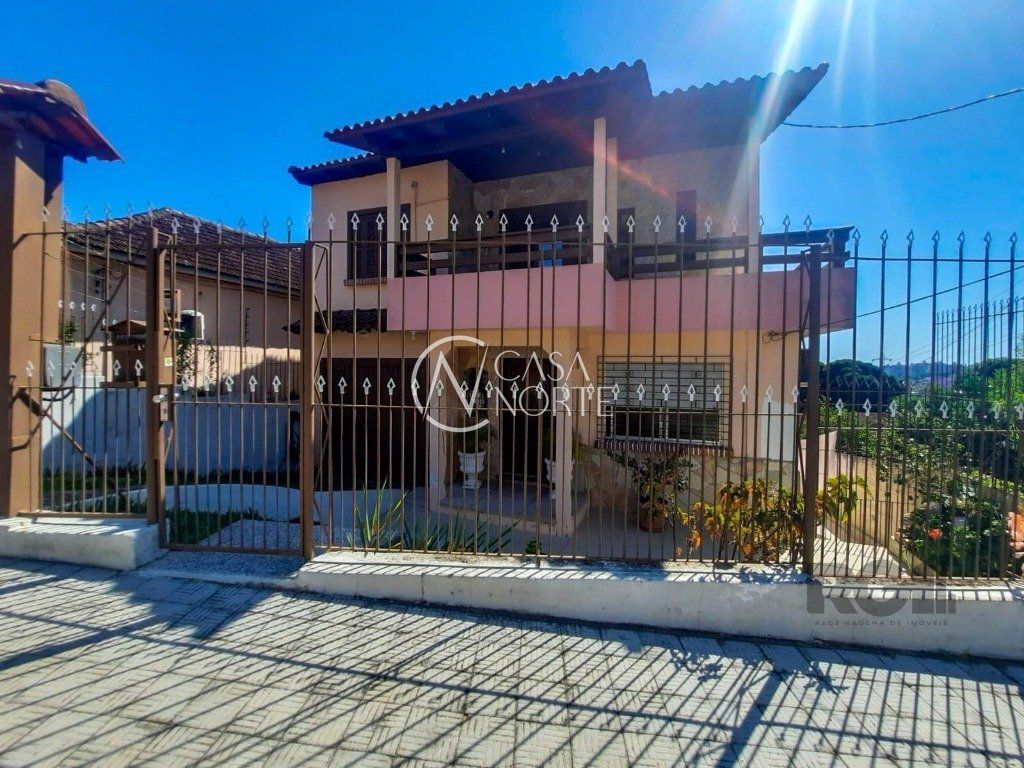 Casa à venda com 4 quartos, 240m², 2 vagas, Rua Engenheiro Oscar da Cunha Correa no bairro Jardim Carvalho em Porto Alegre