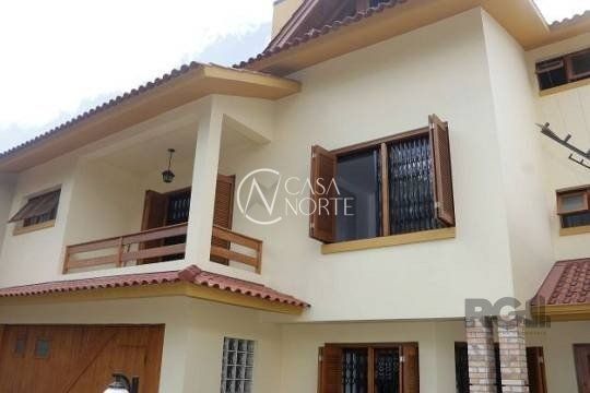 Casa à venda com 3 quartos, 287m², 1 suíte, 4 vagas, Rua Padre Todesco no bairro Partenon em Porto Alegre