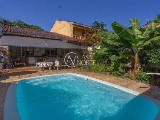 Casa à venda com 3 quartos, 131m², 1 suíte, 3 vagas, Rua Menezes Paredes no bairro Nonoai em Porto Alegre