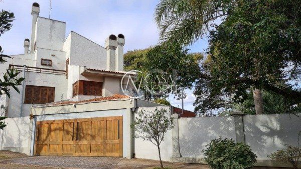 Casa de Condomínio à venda com 4 quartos, 741m², 4 suítes, 2 vagas, Rua Gustavo Schmidt no bairro Três Figueiras em Porto Alegre