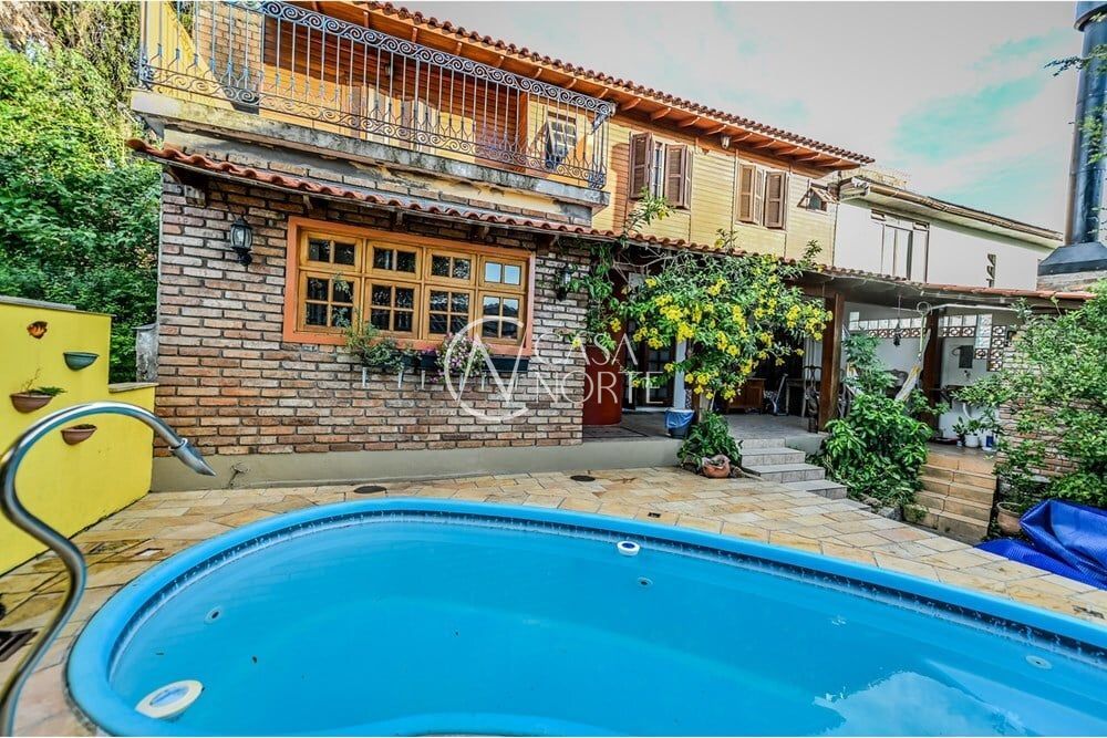 Casa de Condomínio à venda com 4 quartos, 200m², 1 suíte, 2 vagas, Das Figueiras no bairro Santa Tereza em Porto Alegre