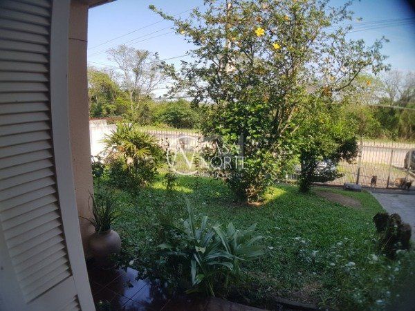 Casa à venda com 3 quartos, 252m², 2 vagas, Rua Doutor Cecilio Monza no bairro Belém Novo em Porto Alegre