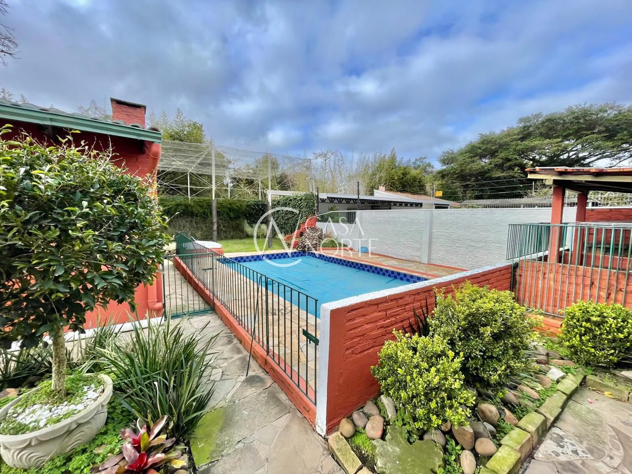 Casa à venda com 3 quartos, 338m², 2 suítes, 5 vagas, Rua Gávea no bairro Ipanema em Porto Alegre