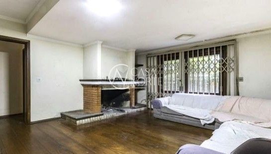 Casa à venda com 5 quartos, 340m², 1 suíte, 4 vagas, Rua Eudoro Berlink no bairro Auxiliadora em Porto Alegre