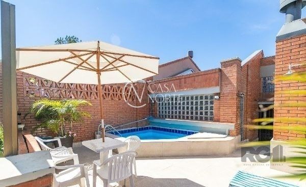 Casa de Condomínio à venda com 3 quartos, 365m², 1 suíte, 3 vagas, Avenida Jacuí no bairro Cristal em Porto Alegre