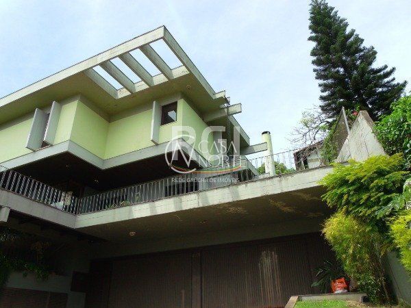 Casa à venda com 4 quartos, 700m², 4 suítes, 6 vagas, Rua Coronel Gomes de Carvalho no bairro Sétimo Céu em Porto Alegre