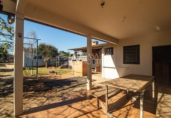 Casa à venda com 6 quartos, 248m², 1 suíte, 7 vagas, Beco Pedro Rodrigues Bittencourt no bairro Vila Nova em Porto Alegre