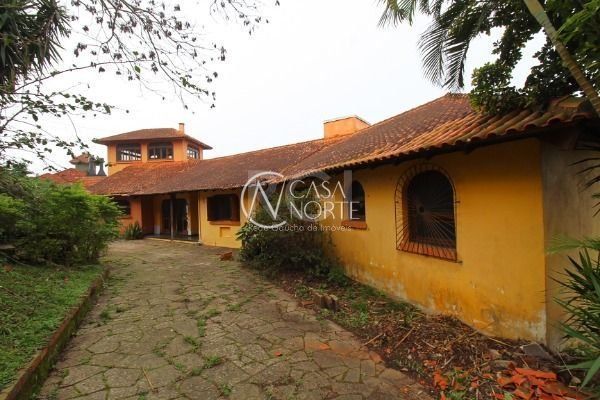 Casa à venda com 6 quartos, 596m², 4 suítes, 6 vagas, Rua Professor Antônio Davila no bairro Sétimo Céu em Porto Alegre