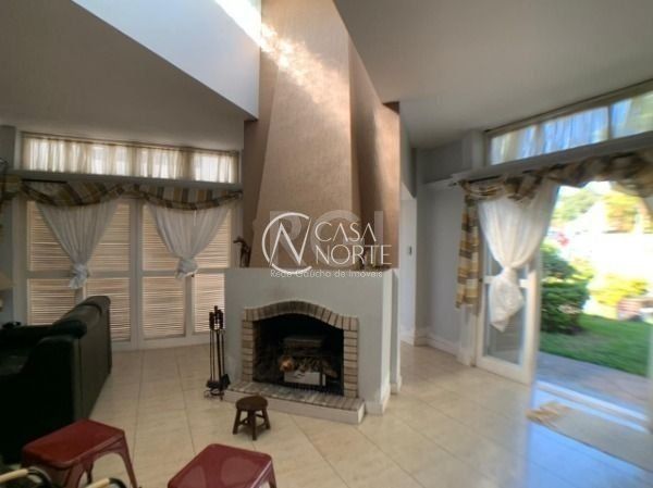 Casa à venda com 3 quartos, 333m², 1 suíte, 4 vagas, Rua Engenheiro Tito Marques Fernandes no bairro Ipanema em Porto Alegre