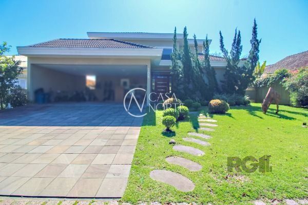 Casa de Condomínio à venda com 4 quartos, 405m², 4 suítes, 4 vagas, Avenida Juca Batista no bairro Chapéu do Sol em Porto Alegre