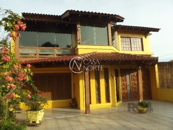 Casa à venda com 4 quartos, 320m², 1 suíte, 2 vagas, Rua Marques do Marica no bairro Vila Nova em Porto Alegre