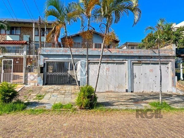 Casa à venda com 4 quartos, 536m², 1 suíte, 5 vagas, Rua General Rondon no bairro Tristeza em Porto Alegre