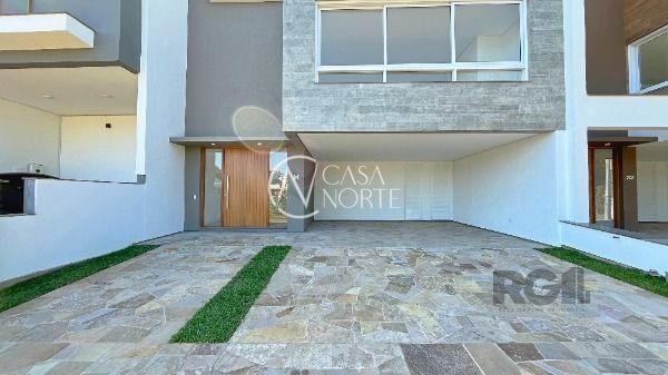 Casa de Condomínio à venda com 3 quartos, 254m², 3 suítes, 2 vagas, Rua Ivo Walter Kern no bairro Hípica em Porto Alegre