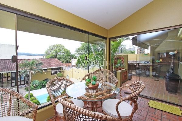 Casa à venda com 4 quartos, 287m², 1 suíte, 4 vagas, Rua Lloyd de Andrade Polidoro no bairro Ipanema em Porto Alegre