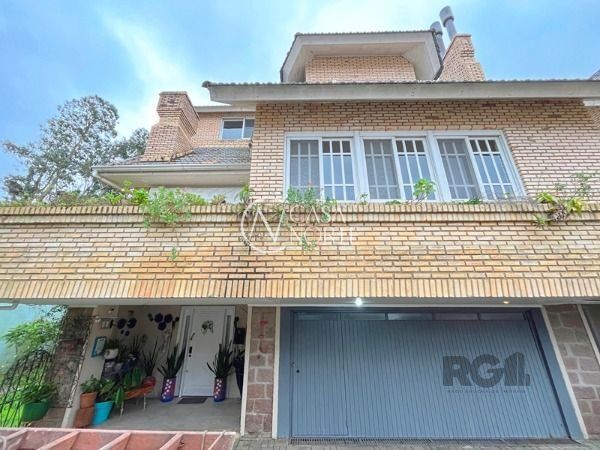 Casa de Condomínio à venda com 3 quartos, 322m², 1 suíte, 2 vagas, Rua Doutor Arnaldo da Silva Ferreira no bairro Jardim Isabel em Porto Alegre