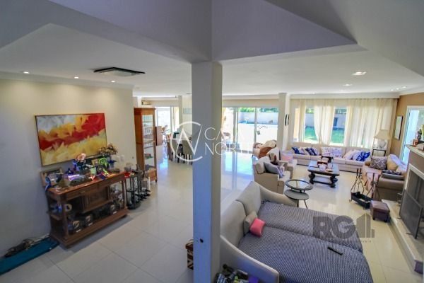 Casa de Condomínio à venda com 4 quartos, 405m², 4 suítes, 4 vagas, Avenida Juca Batista no bairro Chapéu do Sol em Porto Alegre