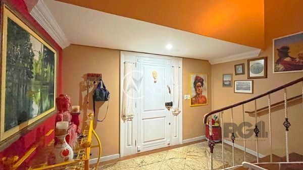 Casa de Condomínio à venda com 3 quartos, 322m², 1 suíte, 2 vagas, Rua Doutor Arnaldo da Silva Ferreira no bairro Jardim Isabel em Porto Alegre