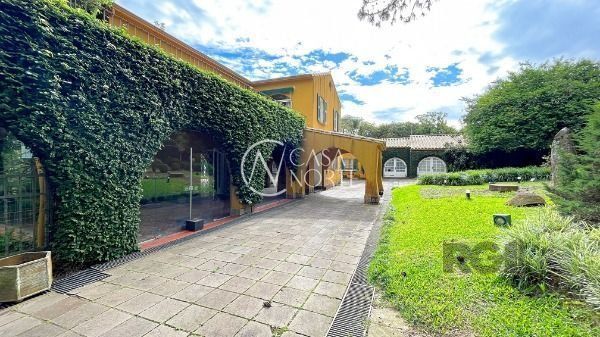 Casa à venda com 7 quartos, 720m², 6 vagas, Avenida Coronel Marcos no bairro Pedra Redonda em Porto Alegre