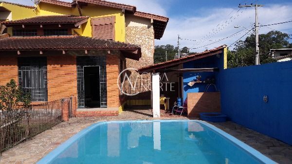 Casa à venda com 4 quartos, 350m², 2 suítes, 4 vagas, Acesso Doutor Marino dos Santos no bairro Aberta dos Morros em Porto Alegre