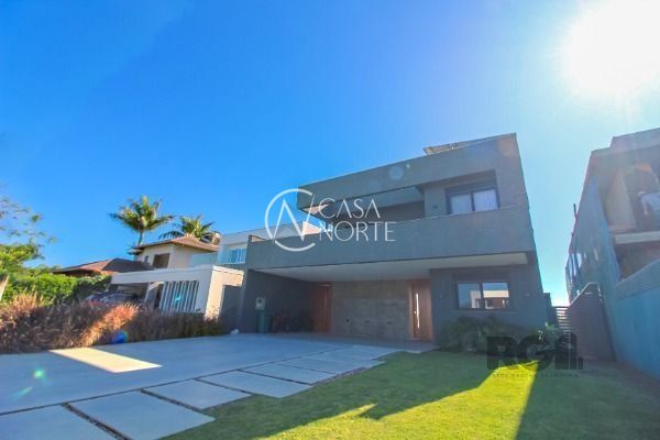 Casa de Condomínio à venda com 4 quartos, 450m², 4 suítes, 2 vagas, Avenida Juca Batista no bairro Belém Novo em Porto Alegre