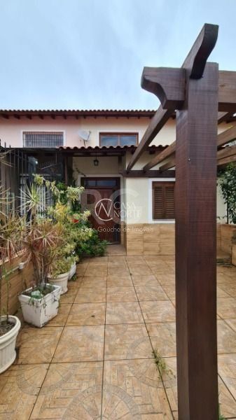 Casa à venda com 2 quartos, 100m², 1 suíte, 1 vaga, Rua Hilario Gonçalves Pinha no bairro Hípica em Porto Alegre