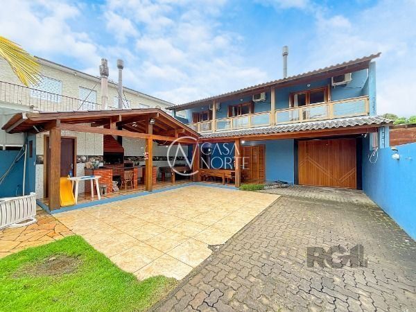 Casa à venda com 4 quartos, 399m², 1 suíte, 6 vagas, Rua Jerolomo Minuzo no bairro Vila Nova em Porto Alegre