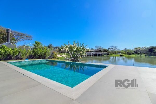 Casa de Condomínio à venda com 4 quartos, 450m², 4 suítes, 2 vagas, Avenida Juca Batista no bairro Belém Novo em Porto Alegre