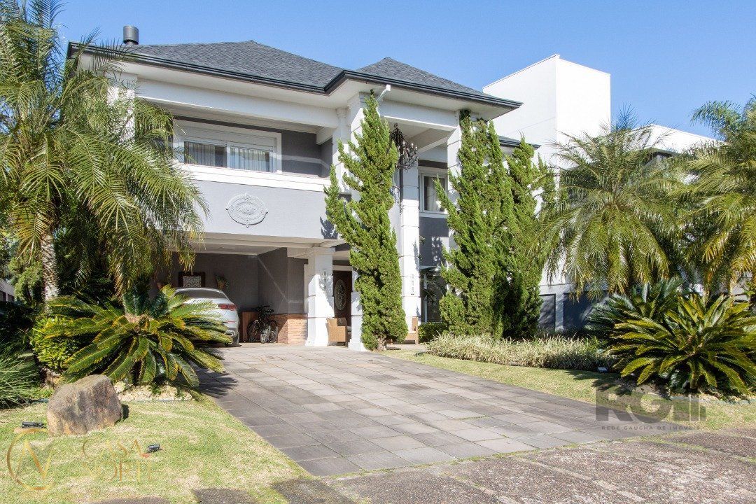 Casa de Condomínio à venda com 3 quartos, 527m², 3 suítes, 4 vagas, Avenida Juca Batista no bairro Belém Novo em Porto Alegre