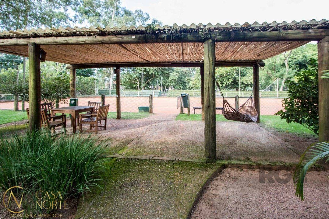 Casa de Condomínio à venda com 3 quartos, 318m², 3 suítes, 4 vagas, Avenida Juca Batista no bairro Belém Novo em Porto Alegre