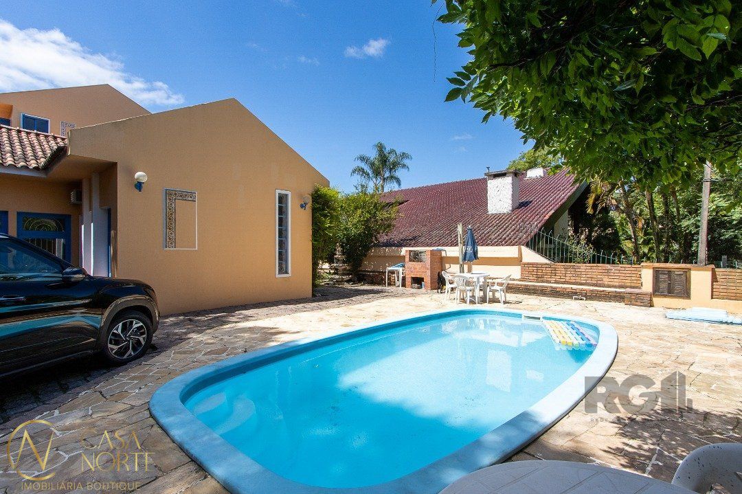 Casa à venda com 4 quartos, 580m², 3 suítes, 5 vagas, Rua João Mendes Ouriques no bairro Jardim Isabel em Porto Alegre