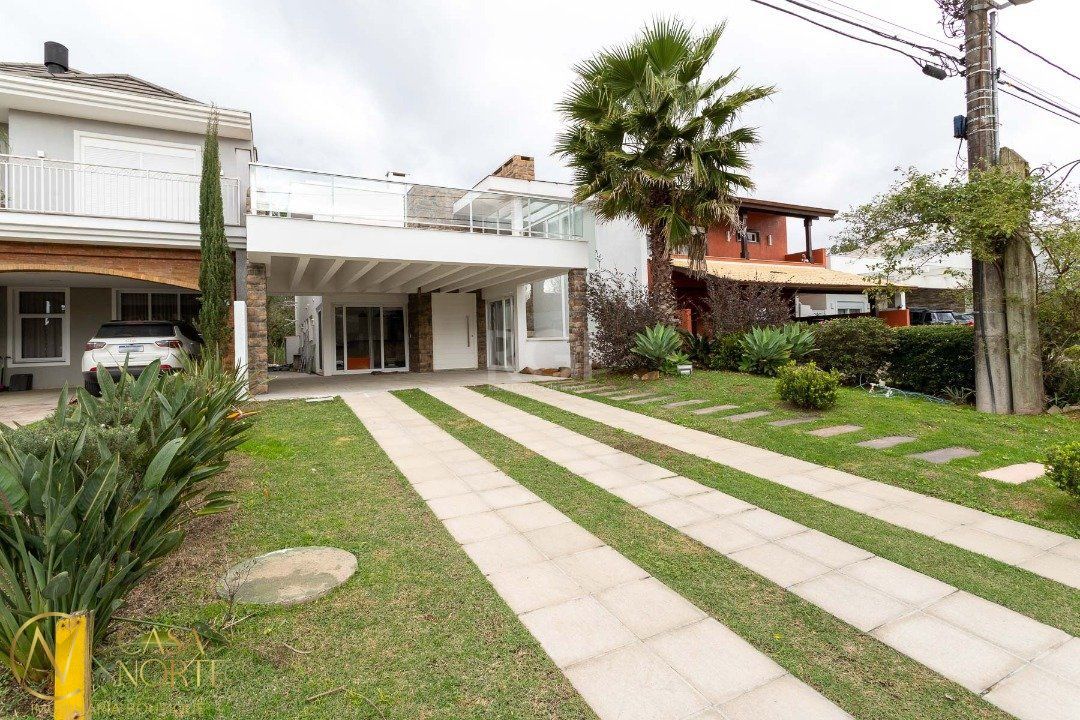 Casa de Condomínio à venda com 5 quartos, 294m², 5 suítes, 4 vagas, Avenida Juca Batista no bairro Belém Novo em Porto Alegre