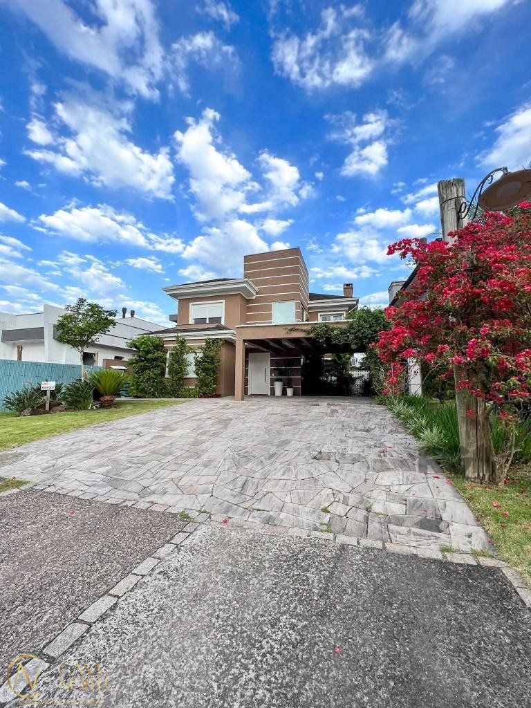 Casa de Condomínio à venda com 4 quartos, 320m², 4 suítes, 4 vagas, Avenida Juca Batista no bairro Belém Novo em Porto Alegre