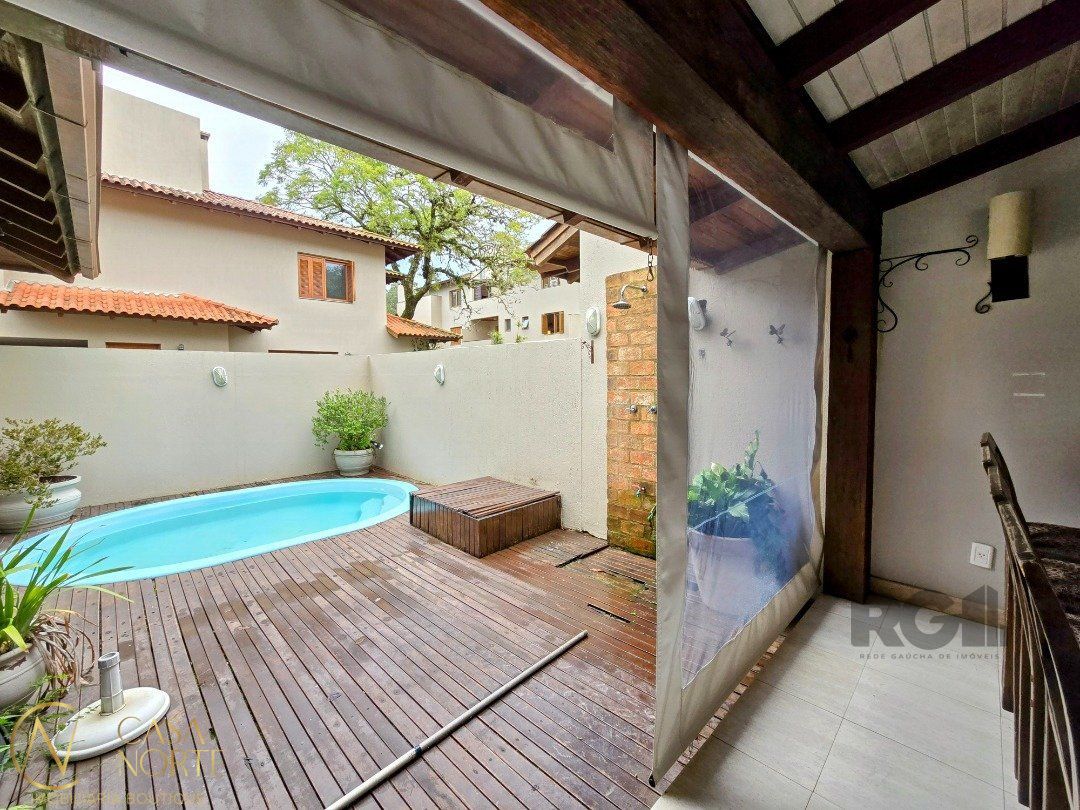 Casa de Condomínio à venda com 4 quartos, 299m², 2 suítes, 3 vagas, Travessa Pedra Redonda no bairro Jardim Isabel em Porto Alegre