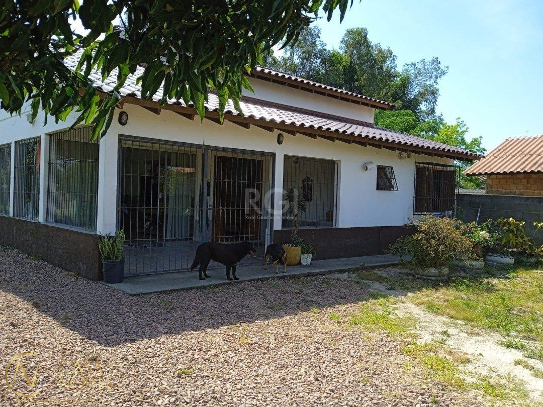 Casa à venda com 2 quartos, 72m², 2 suítes, Rua Oito Mil e Treze no bairro Lageado em Porto Alegre