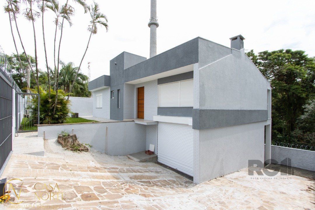 Casa à venda com 3 quartos, 260m², 2 suítes, 4 vagas, Rua Corrêa Lima no bairro Santa Tereza em Porto Alegre
