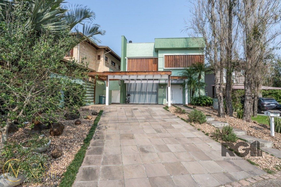 Casa de Condomínio à venda com 3 quartos, 261m², 3 suítes, 2 vagas, Avenida Juca Batista no bairro Belém Novo em Porto Alegre
