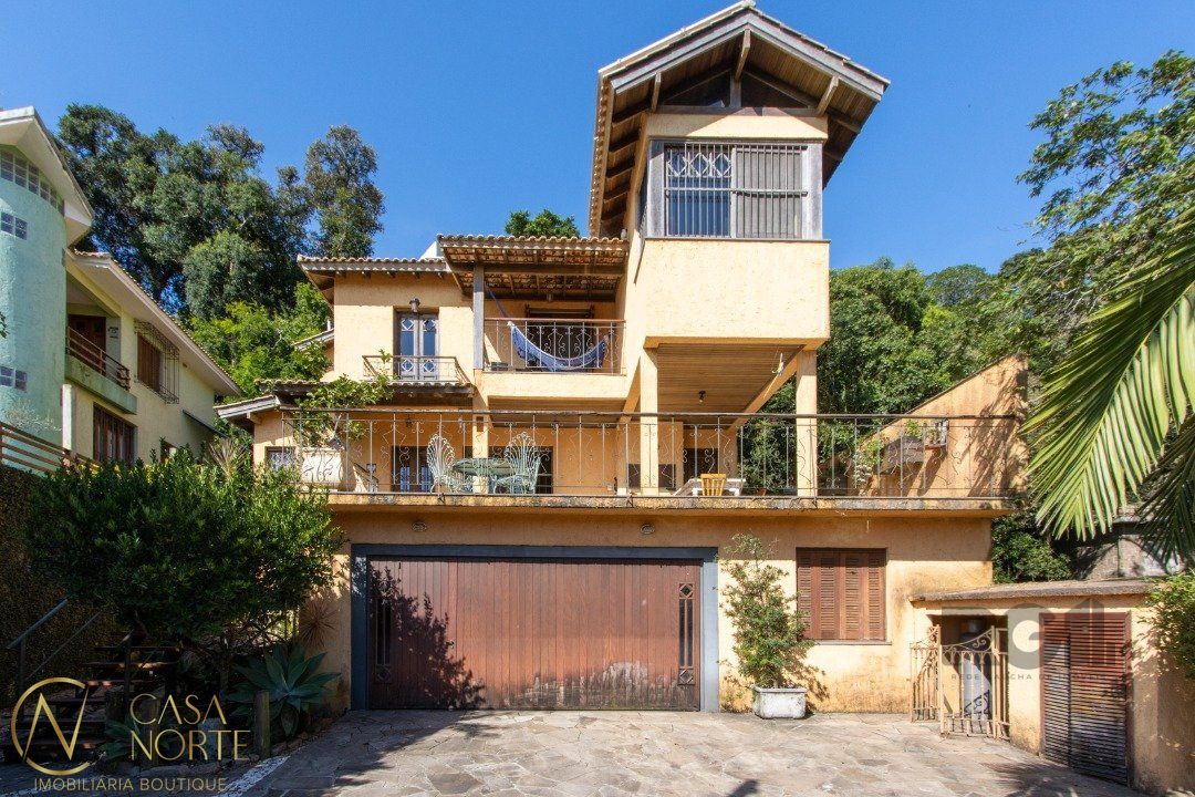 Casa à venda com 4 quartos, 323m², 1 suíte, 5 vagas, Avenida Guaiba no bairro Ipanema em Porto Alegre