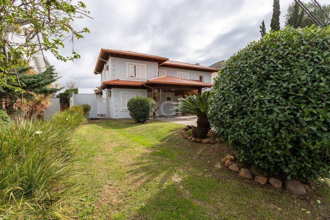 Casa de Condomínio à venda com 3 quartos, 348m², 1 suíte, 2 vagas, Avenida Juca Batista no bairro Chapéu do Sol em Porto Alegre