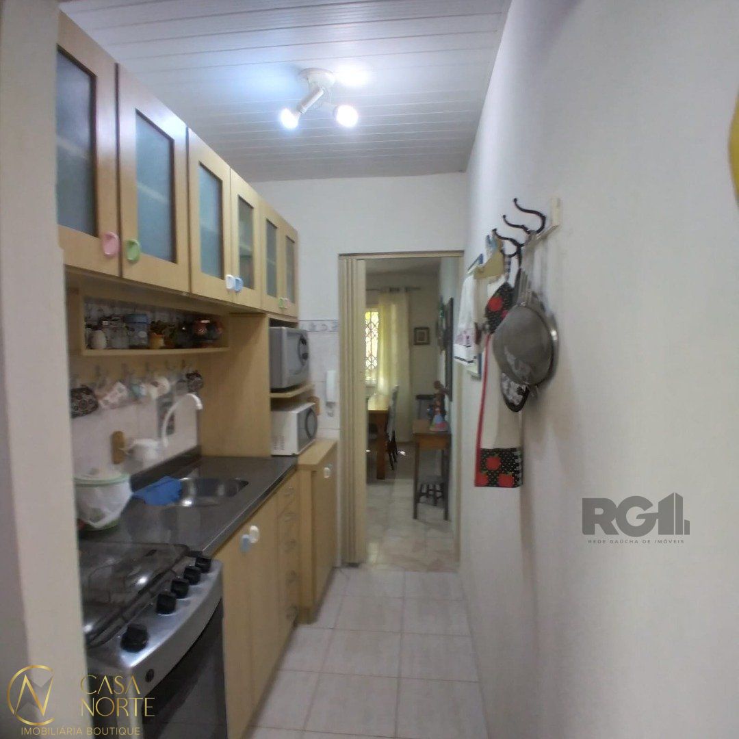 Casa de Condomínio à venda com 3 quartos, 119m², 2 vagas, Rua Coronel Frederico Carlos Gomes no bairro Vila Nova em Porto Alegre
