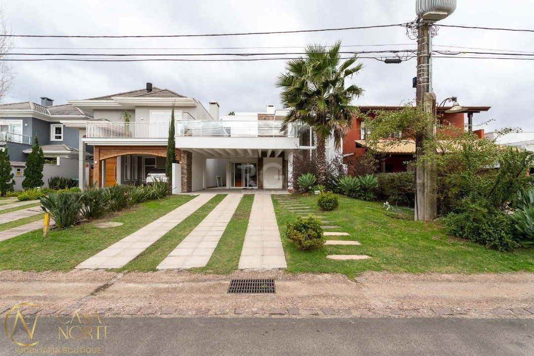 Casa de Condomínio à venda com 5 quartos, 294m², 5 suítes, 4 vagas, Avenida Juca Batista no bairro Belém Novo em Porto Alegre