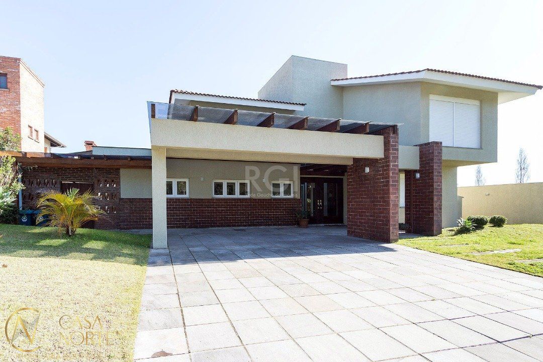 Casa de Condomínio à venda com 5 quartos, 480m², 4 suítes, 4 vagas, Avenida Juca Batista no bairro Belém Novo em Porto Alegre
