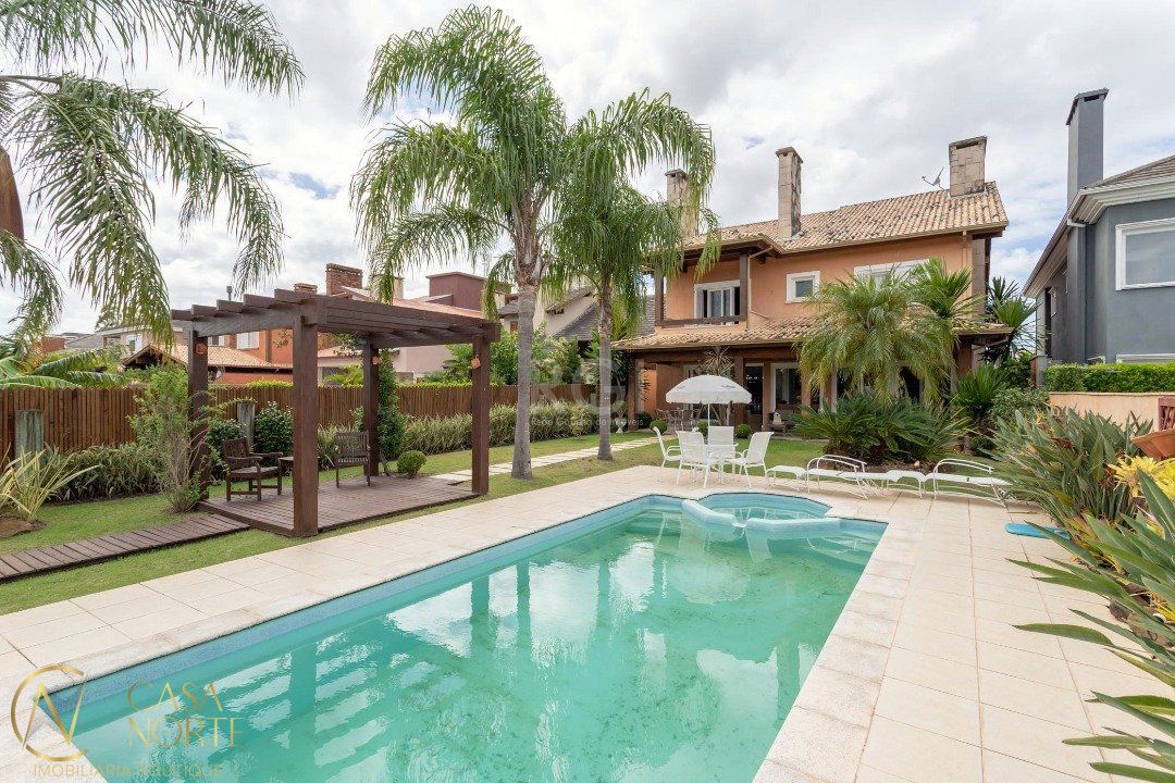 Casa de Condomínio à venda com 4 quartos, 386m², 4 suítes, 4 vagas, Avenida Juca Batista no bairro Belém Novo em Porto Alegre
