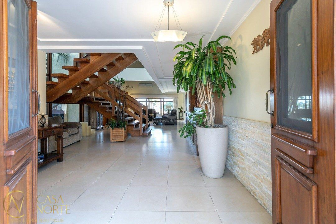 Casa de Condomínio à venda com 5 quartos, 670m², 5 suítes, 4 vagas, Avenida Juca Batista no bairro Belém Novo em Porto Alegre