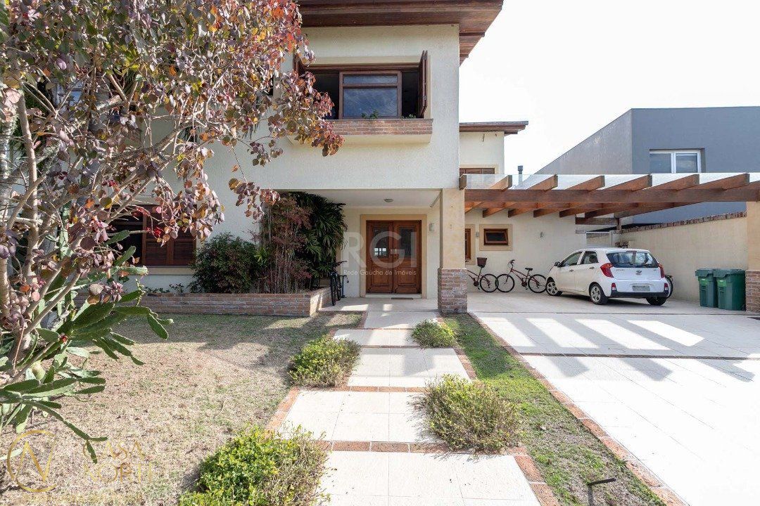 Casa de Condomínio à venda com 5 quartos, 670m², 5 suítes, 4 vagas, Avenida Juca Batista no bairro Belém Novo em Porto Alegre